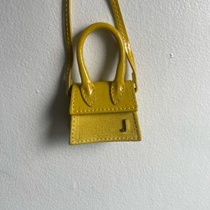 Jacquemus Yellow “Le petit Chiquito” necklace bag.